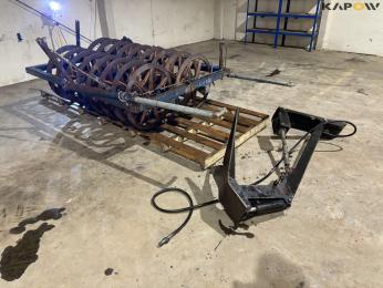 Soil packers with catch arm