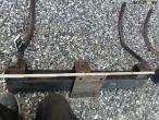 Heavy-duty frame with track eradicator teeth 19