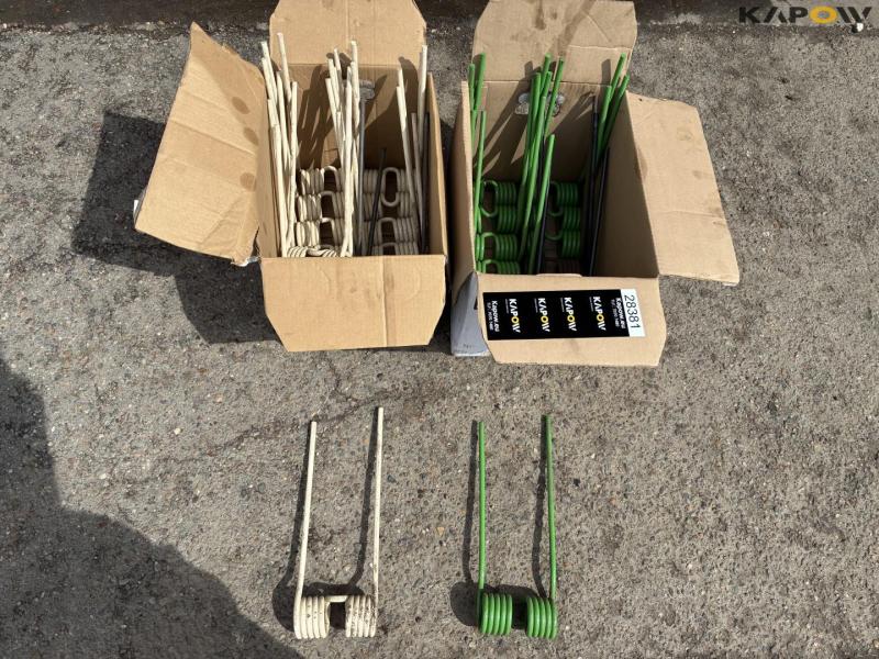 Crown rake/spreader spring 1
