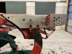 Kverneland EG100 6 furrow reversible plough with soil packers 9