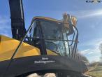 New Holland FR550 with corn header and pickup 30