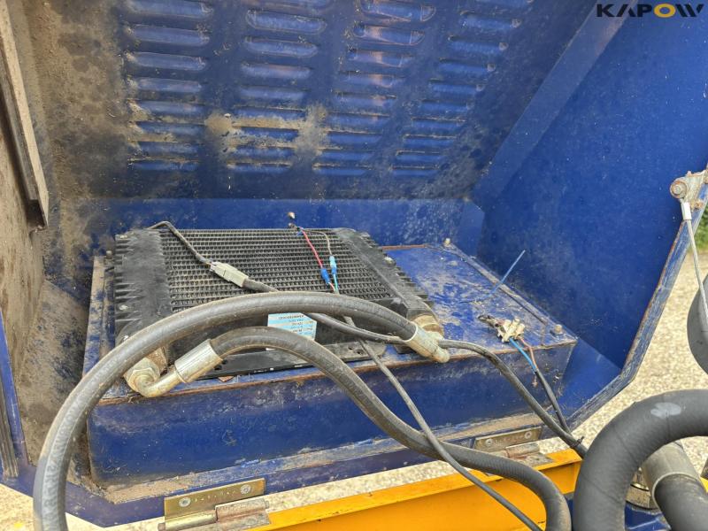 New Holland TS 115 with Bomford arm mower 60