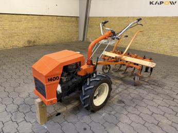 Tool carrier with harrow