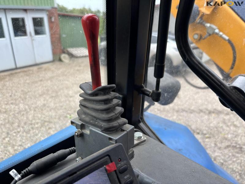 New Holland TS 115 med Bomford armklipper 52