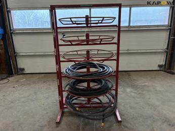 Shelf for hydraulic hoses