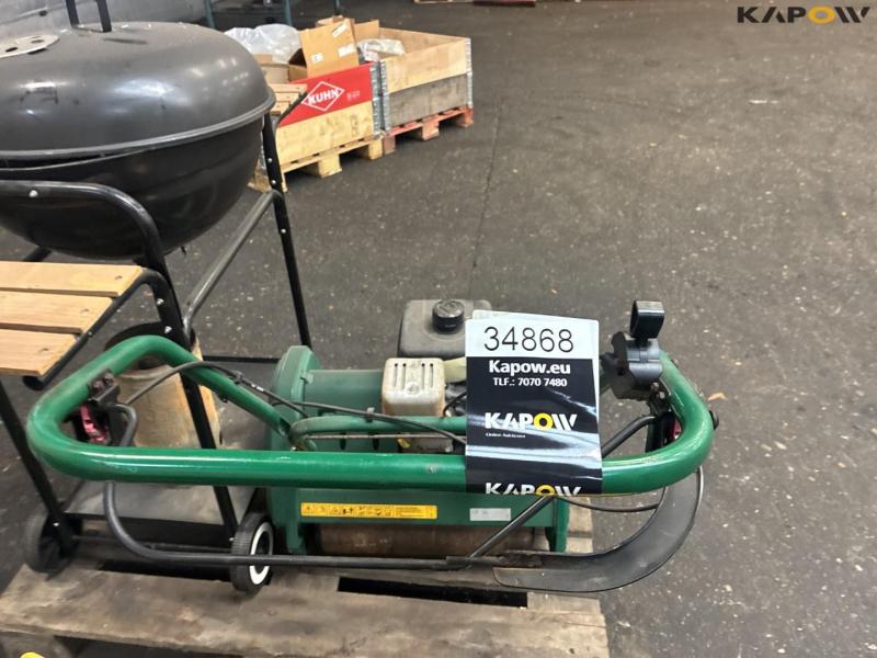 2 lawn mowers and grill 17