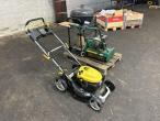2 lawn mowers and grill 3