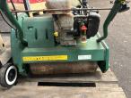 2 lawn mowers and grill 16