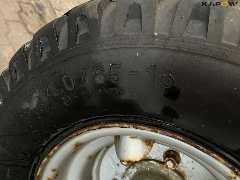 Axle with 14.0/65-16 9