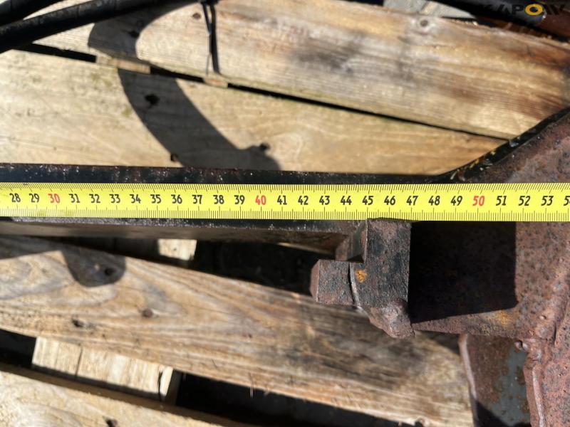 Grapple arm for pallet forks 11