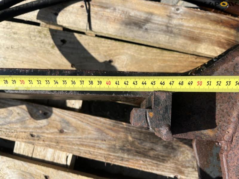 Grapple arm for pallet forks 12