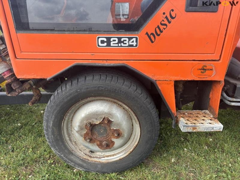 Holder C 2.34 with sweeper and salt spreader 77