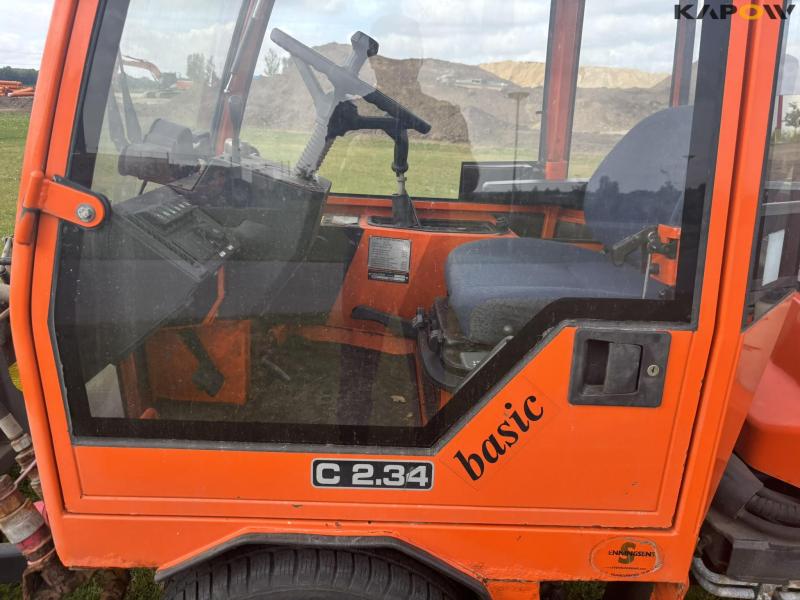 Holder C 2.34 with sweeper and salt spreader 80