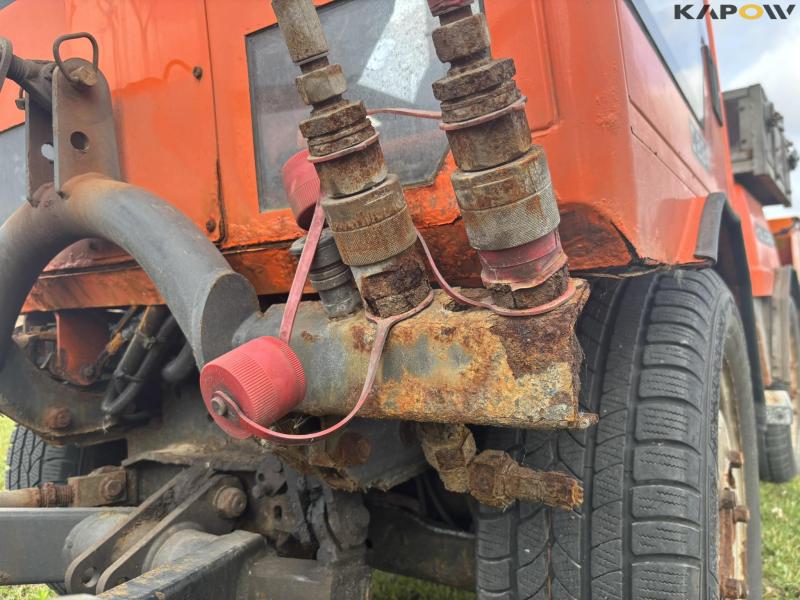 Holder C 2.34 with sweeper and salt spreader 83