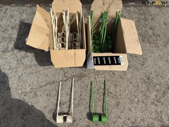 Crown rake/spreader spring