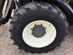 New Holland 8560 tractor with Hauer P-O-M S150 front loader 74