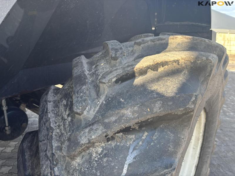 New Holland FR550 with corn header and pickup 46