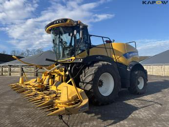 New Holland FR550 with corn header and... 