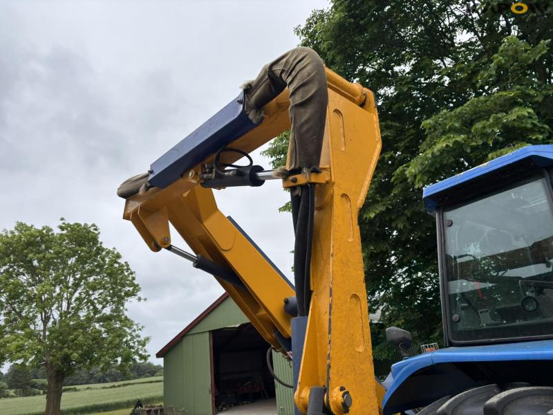 New Holland TS 115 with Bomford arm mower 80