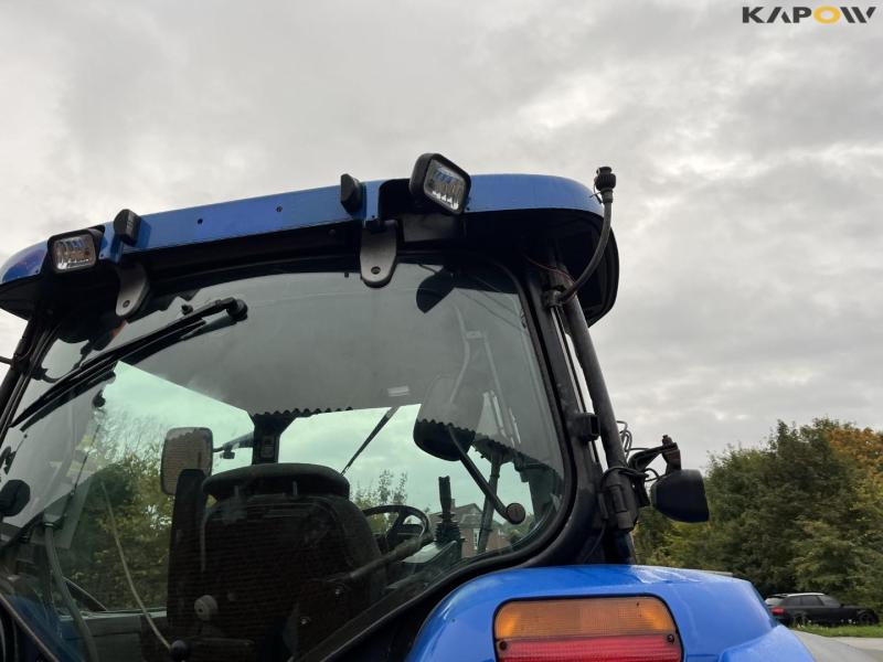 New Holland TS135A tractor with Epoke arm mower 24