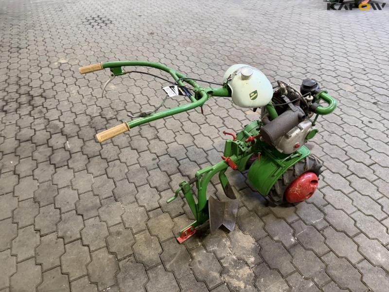 Tool carrier with plow 5