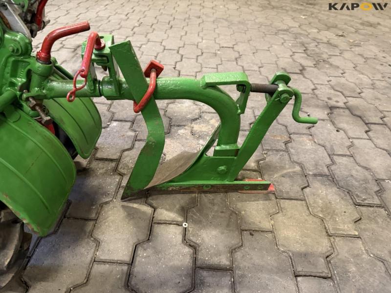 Tool carrier with plow 9