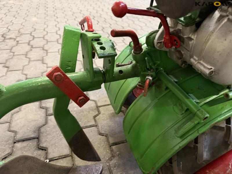 Tool carrier with plow 10