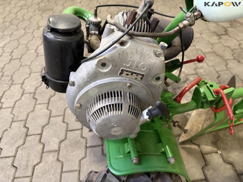 Tool carrier with plow 16