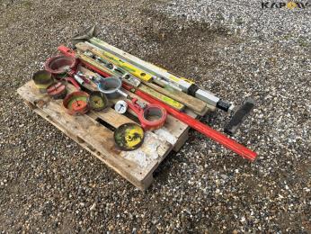 Pipe cutter, spirit level and cup drill