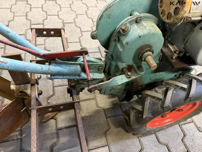 The Farmers Boy tool carrier with plow 22