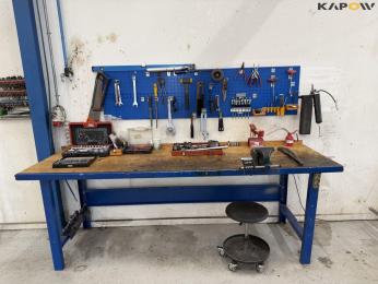 Workshop table with tools and blackboard