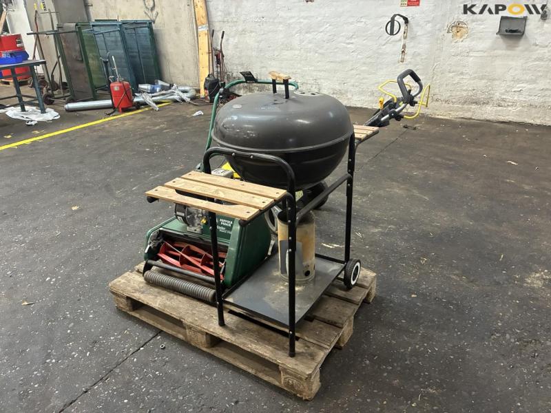 2 lawn mowers and grill 7