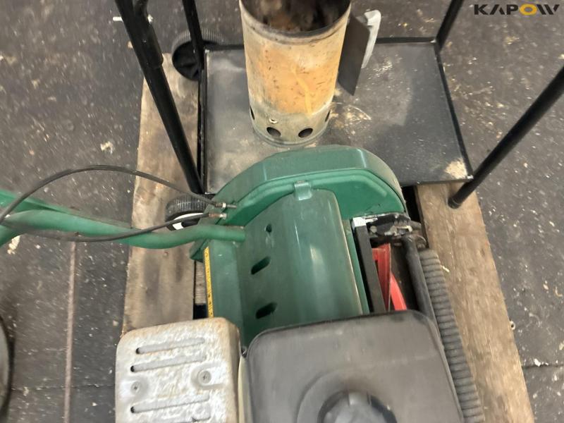 2 lawn mowers and grill 12