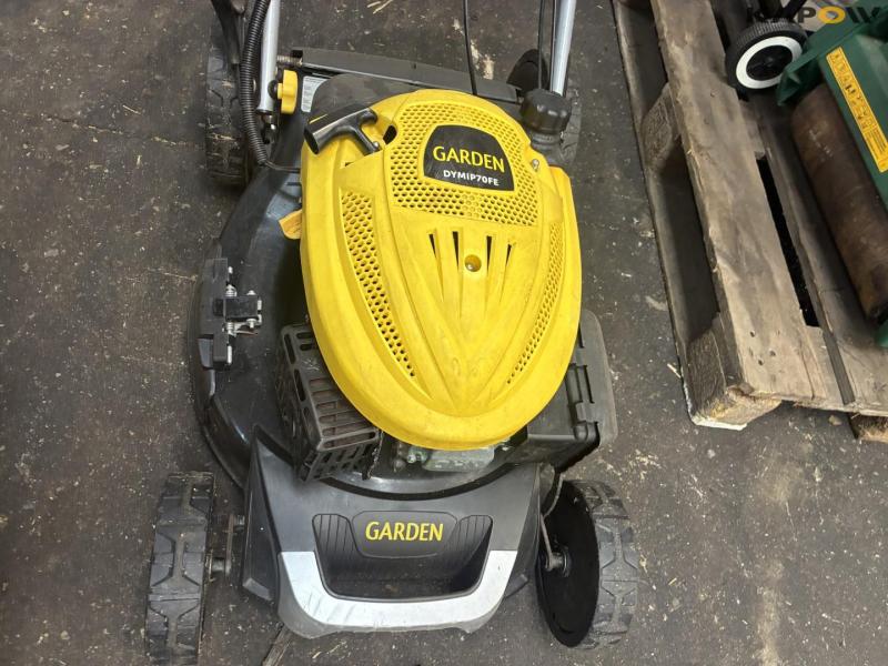 2 lawn mowers and grill 18