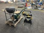 2 lawn mowers and grill 5