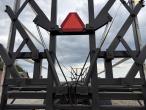 Straw wagon with hydraulic bale securing 23