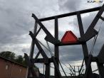 Straw wagon with hydraulic bale securing 25