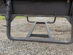 Straw wagon with hydraulic bale securing 27