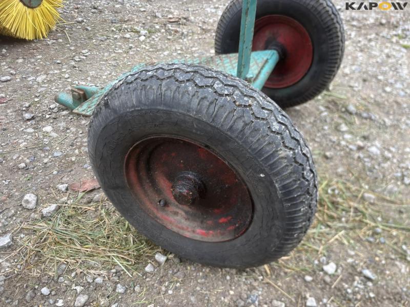 JRUS tool carrier with broom, scraper and sulky 50