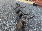 Heavy-duty frame with track eradicator teeth 26