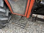 New Holland 45-66S compact tractor with sweeper and salt spreader 18