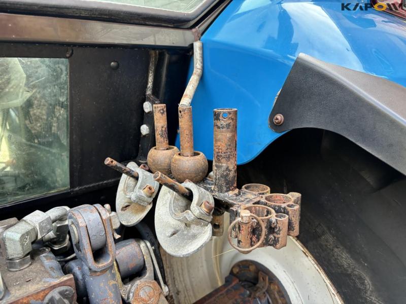 New Holland 8560 tractor with Hauer P-O-M S150 front loader 43