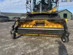New Holland FR550 with corn header and pickup 73