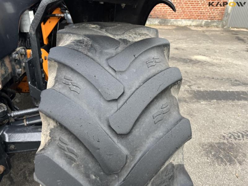 New Holland TS135A tractor with Epoke arm mower 14