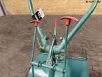Tool carrier with spring cutter 25