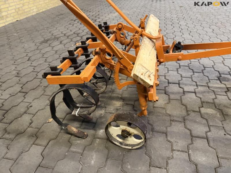 Tool carrier with harrow 37