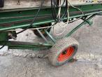 Potato planter with belt spreader 24