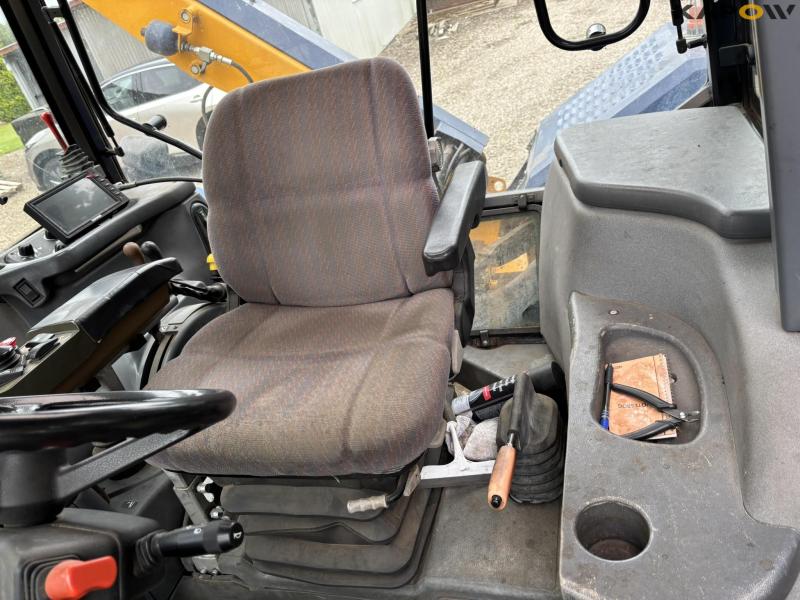 New Holland TS 115 with Bomford arm mower 44